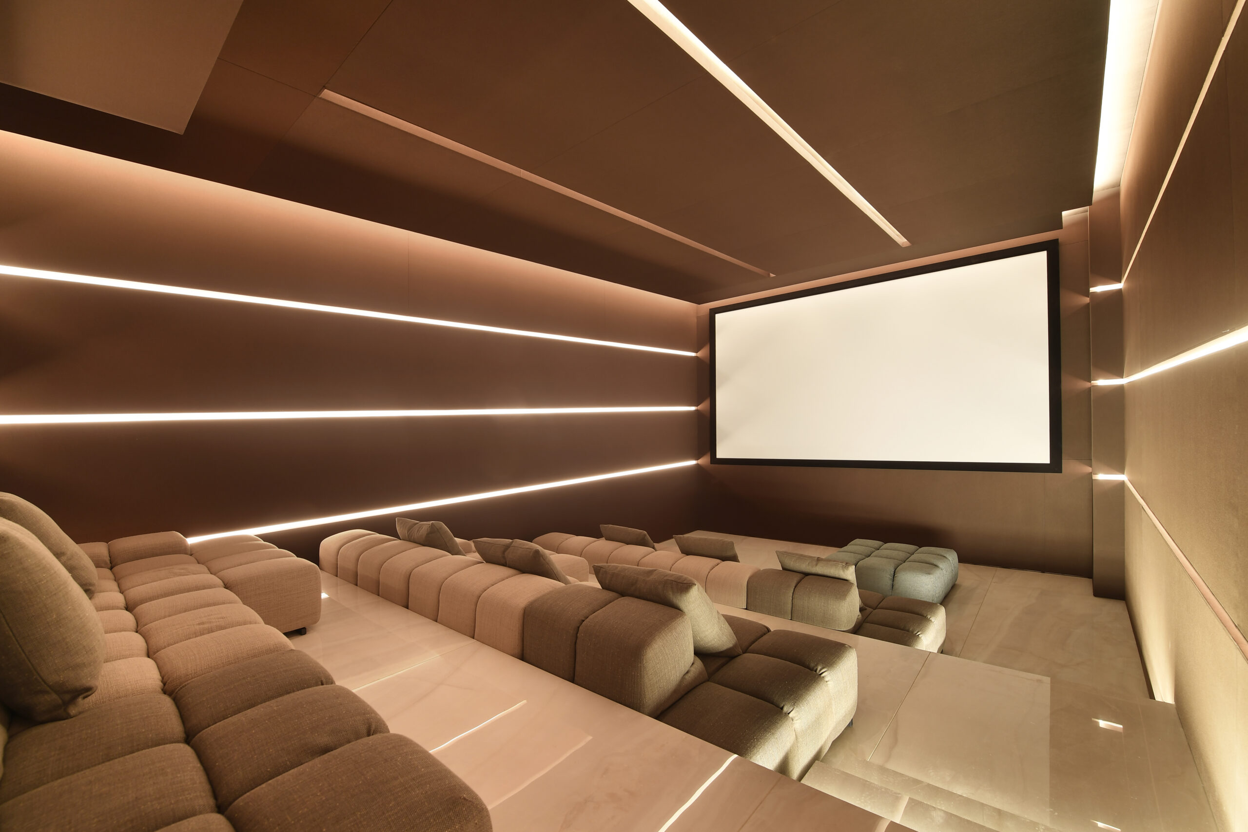Luxury home movie theater with custom seating in Dubai.